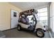Enclosed garage featuring a golf cart with seating and storage at 1228 Maria Ct, Lady Lake, FL 32159