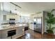 Modern kitchen featuring granite countertops, stainless steel appliances, and an island with breakfast bar at 1228 Maria Ct, Lady Lake, FL 32159