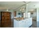 Open-concept living space featuring granite island and plenty of room for relaxing and entertaining at 1228 Maria Ct, Lady Lake, FL 32159