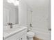 Bathroom features stylish finishes and vanity with sink and shower at 12974 Se 42Nd Ct, Belleview, FL 34420