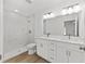 Bathroom boasts double vanity, shower and luxurious finishes at 12974 Se 42Nd Ct, Belleview, FL 34420