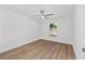 Bedroom featuring wood-look flooring, a ceiling fan and natural light at 12974 Se 42Nd Ct, Belleview, FL 34420