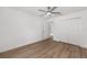 Bedroom with closet, ceiling fan and wood-look floors at 12974 Se 42Nd Ct, Belleview, FL 34420