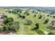 Picturesque view of a golf course community showcasing lush green fairways and well-manicured landscapes at 13015 Se 93Rd Cir, Summerfield, FL 34491