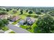 Desirable single-story home on golf course featuring lush landscaping and an attached two-car garage at 13015 Se 93Rd Cir, Summerfield, FL 34491