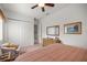Bedroom with comfortable chair, closet and dresser at 13015 Se 93Rd Cir, Summerfield, FL 34491