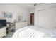 Comfortable bedroom features a dresser, closet, and reading nook at 13015 Se 93Rd Cir, Summerfield, FL 34491