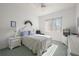 Cozy bedroom with bright natural light and white furniture at 13015 Se 93Rd Cir, Summerfield, FL 34491
