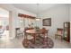 Formal dining room with a round table, seating for six, and natural light at 13015 Se 93Rd Cir, Summerfield, FL 34491