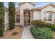 Inviting front entrance featuring manicured landscaping and a walkway to the home at 13015 Se 93Rd Cir, Summerfield, FL 34491