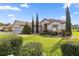 Inviting single-story home showcasing mature landscaping and a well-maintained green lawn at 13015 Se 93Rd Cir, Summerfield, FL 34491