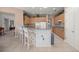 Well-lit kitchen with a bar, modern appliances, and an abundance of cabinetry at 13015 Se 93Rd Cir, Summerfield, FL 34491