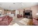 Spacious living room with comfortable seating, large TV, and open access to the kitchen at 13015 Se 93Rd Cir, Summerfield, FL 34491