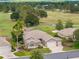 Beautiful home boasts lush landscaping and golf course views in a desirable community at 13495 Se 93Rd Court Rd, Summerfield, FL 34491