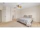 Bedroom with a bed with blue and white patterned bedding and a ceiling fan at 13495 Se 93Rd Court Rd, Summerfield, FL 34491