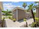 Casita exterior with manicured landscaping, walkway, and quaint windows, blending seamlessly with the tropical surroundings at 13495 Se 93Rd Court Rd, Summerfield, FL 34491