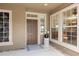 Inviting entryway with natural light, a stylish front door, and views into the home's interior at 13495 Se 93Rd Court Rd, Summerfield, FL 34491