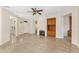Spacious living area with tile floors, fireplace, and built-in shelving, perfect for entertaining at 13495 Se 93Rd Court Rd, Summerfield, FL 34491