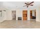 Spacious living room with a fireplace, custom built-ins, and neutral color palette at 13495 Se 93Rd Court Rd, Summerfield, FL 34491