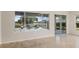 Bright living area with views of outdoor patio, showcasing seamless indoor-outdoor living at 13495 Se 93Rd Court Rd, Summerfield, FL 34491