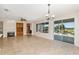 Bright living room featuring a fireplace, custom built-ins, and seamless access to the screened lanai at 13495 Se 93Rd Court Rd, Summerfield, FL 34491