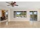 Open-concept living area with views of the lanai and outdoor seating, perfect for entertaining at 13495 Se 93Rd Court Rd, Summerfield, FL 34491