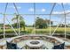 Outdoor space with fire pit, ideal for entertaining and enjoying panoramic golf course views at 13495 Se 93Rd Court Rd, Summerfield, FL 34491