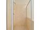 Close-up of a tiled shower with glass door at 13495 Se 93Rd Court Rd, Summerfield, FL 34491