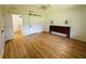 Bright bedroom featuring modern flooring, barn door closet, and unique headboard decor at 14117 Sw 115Th Cir, Dunnellon, FL 34432