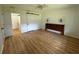 Cozy bedroom featuring wood-look flooring, slider closet, and headboard with sconces at 14117 Sw 115Th Cir, Dunnellon, FL 34432