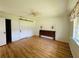 Charming bedroom featuring wood floors, a sliding closet door, and a unique wooden headboard at 14117 Sw 115Th Cir, Dunnellon, FL 34432