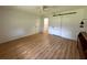 Bright bedroom with wood-look flooring and a sliding barn door to the walk-in closet at 14117 Sw 115Th Cir, Dunnellon, FL 34432