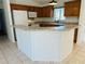 Charming kitchen with white appliances, wooden cabinetry, and peninsula counter area at 14117 Sw 115Th Cir, Dunnellon, FL 34432