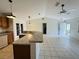 Living room features neutral paint, bright open space, and tile flooring at 14117 Sw 115Th Cir, Dunnellon, FL 34432