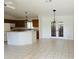 Eat-in kitchen offers a breakfast bar, with plenty of light fixtures and a dining space at 14117 Sw 115Th Cir, Dunnellon, FL 34432
