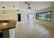 Bright living room with vaulted ceilings and an open concept connecting to the kitchen at 14117 Sw 115Th Cir, Dunnellon, FL 34432