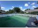 Aerial view of a backyard with artificial turf, a white picket fence, and lush landscaping at 14117 Sw 115Th Cir, Dunnellon, FL 34432