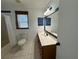 Bathroom featuring tile floors, a wood vanity, and a combination shower and bathtub at 14117 Sw 115Th Cir, Dunnellon, FL 34432