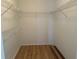 Walk-in closet with wood floors and wire shelving for optimal storage at 14117 Sw 115Th Cir, Dunnellon, FL 34432