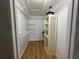Walk-in closet featuring wire rack shelving and wood flooring at 14117 Sw 115Th Cir, Dunnellon, FL 34432