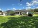 Charming single-story home with a well-manicured lawn and mature landscaping at 14117 Sw 115Th Cir, Dunnellon, FL 34432