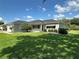 Inviting single-story home featuring a manicured lawn, tasteful landscaping, and a welcoming entrance at 14117 Sw 115Th Cir, Dunnellon, FL 34432