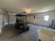 Spacious garage with a golf cart, laundry sink, and ample room for storage at 14117 Sw 115Th Cir, Dunnellon, FL 34432