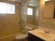 Well-maintained bathroom featuring tiled walls, a bathtub, and vanity with sink at 1675 Se 190Th Ave, Silver Springs, FL 34488