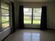 Cozy bedroom with natural light shining through the windows at 1675 Se 190Th Ave, Silver Springs, FL 34488