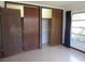 Bright bedroom with closet, window, and curtains at 1675 Se 190Th Ave, Silver Springs, FL 34488