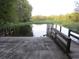 Concrete boat ramp with wooden pier at 1675 Se 190Th Ave, Silver Springs, FL 34488