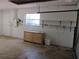 Garage featuring a chest of drawers and a wall of shelving at 1675 Se 190Th Ave, Silver Springs, FL 34488