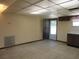 View of the living room area with door to outside and kitchen amenities, featuring tile flooring at 1675 Se 190Th Ave, Silver Springs, FL 34488