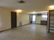 Open living room with neutral walls, tile floors, and doorway to outside at 1675 Se 190Th Ave, Silver Springs, FL 34488